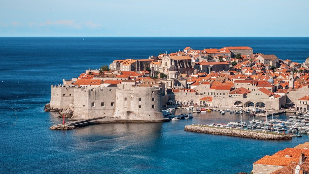 Dubrovnik city walls overlooking terracotta rooftops and Adriatic