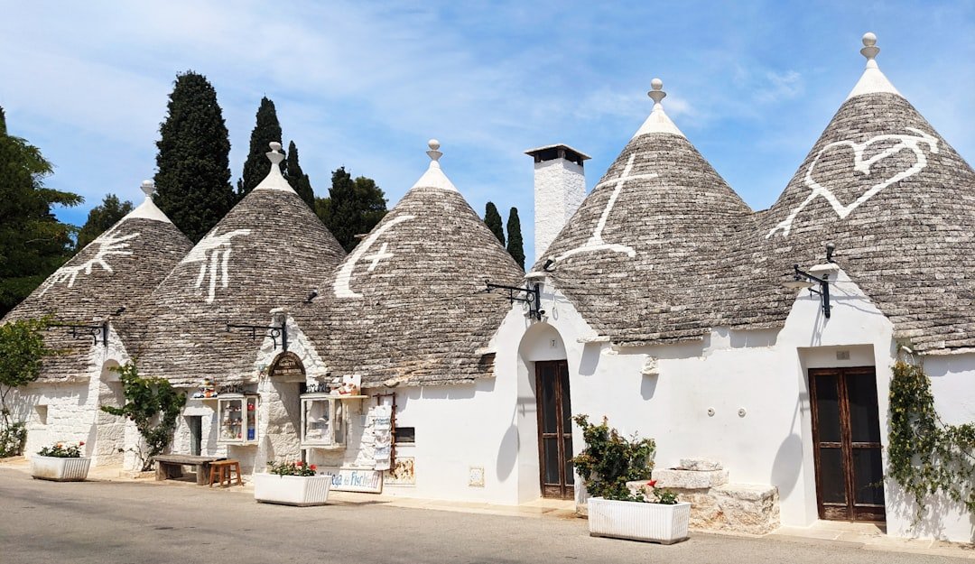 Alberobello white trulli conical roofs