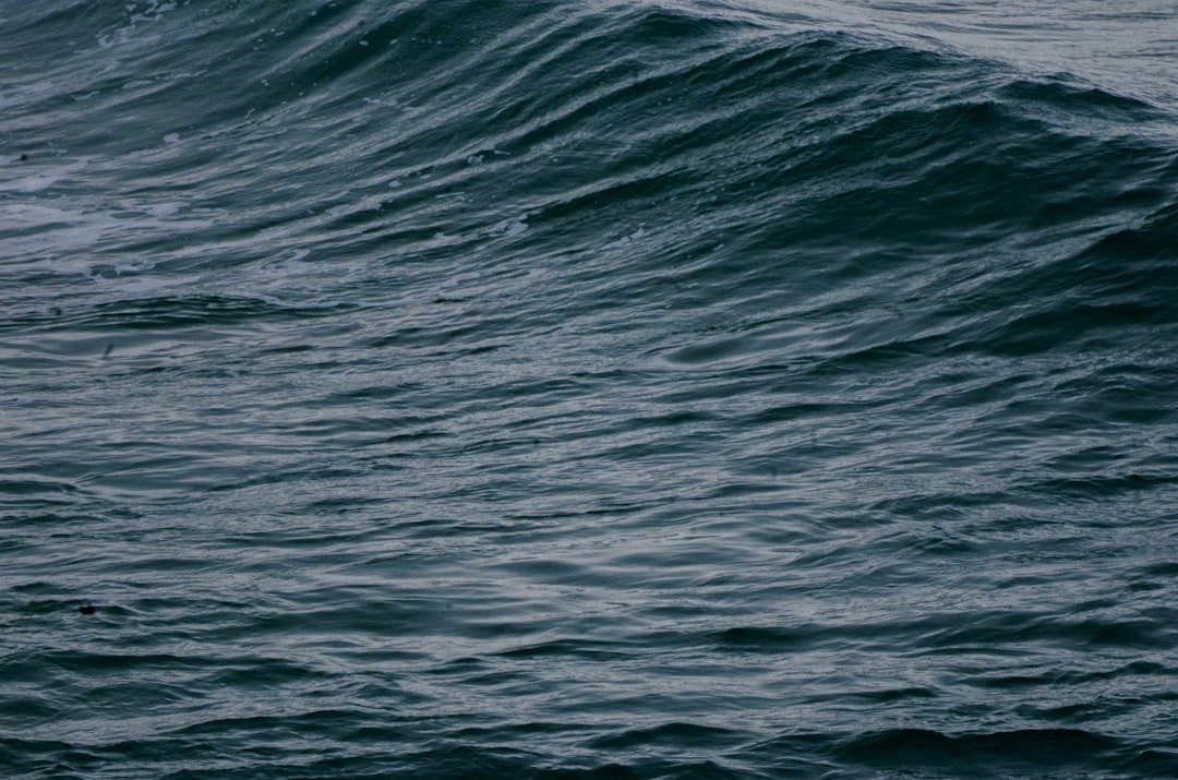 Rocher de la Vierge rock with Atlantic surf Biarritz