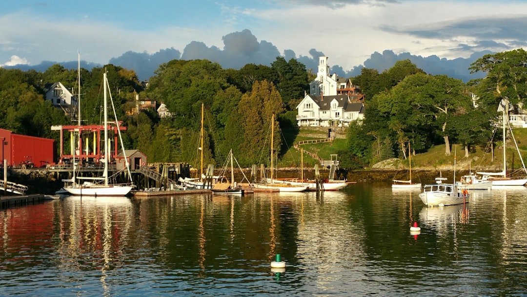 Camden Maine harbor boats town and rocky shore
